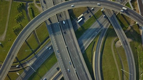 Drone top down picturesque road junction Saint Petersburg abstract layered traffic intersection of roads sharp turns complex structure. Active traffic cars transportation. Logistics Travel Russia 4k
