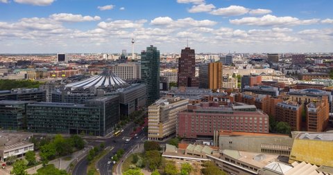BERLIN, GERMANY - May 20, 2020: Aerial view of the Bahntower and Sony Center at Potsdamer Platz. The iconic skyscrapers of Potsdamer Platz have become a major tourist attraction. Time lapse 4K.