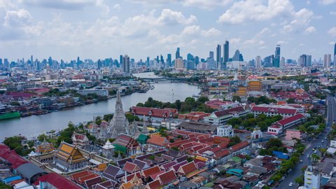 Aerial hyperlapse video of Wat Arun and Bangkok city along Chaophraya river, Thailand. The video is shaking due to camera shake, motion blur, overuse of noise reduction.
