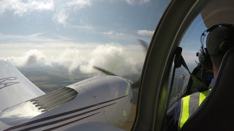 Flying through the clouds on twin engine aircraft. Cockpit view.