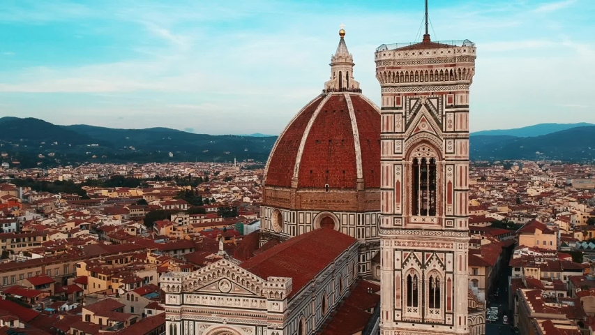 Establishing aerial view of Florence Cathedral Duomo, Firenze Cattedrale di Santa Maria del Fiore in Firenze, Florence, Italy on a sunny day | Shutterstock HD Video #1052884763