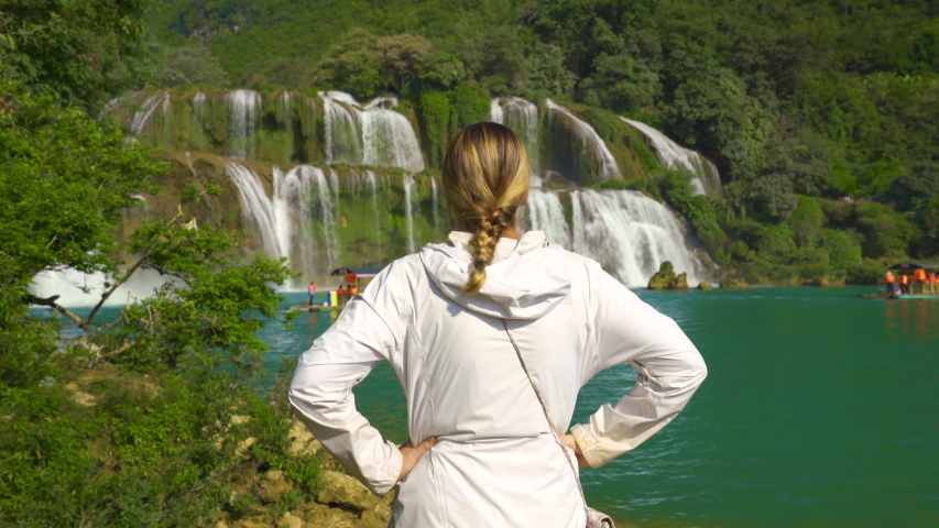 Rear View of Confident Woman Tourist Watching Ban Gioc Waterfall