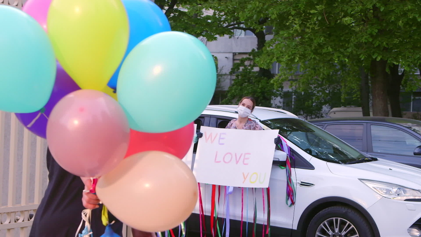 Birthday Surprise Women Girls Party Reception Baloons Car Keeping Social Distancing During Pandemic Coronavirus, Covid-19. Colorful Handwritten Message on Cardboard.