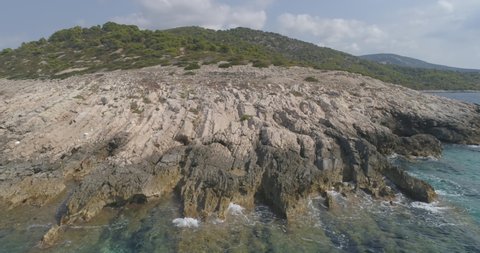 Croatian islands arial shot. beautiful flight over islands, sea, trees, beautiful scenery, waves. drone video.
