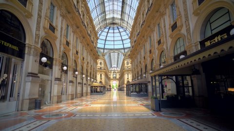 Milan, Italy, May 1, 2020: Vittorio Emanuele Gallery is empty of people and a tourist. Piazza Duomo. The quarantine from Covid19 in Italy. Quarantine in Milan. Closed luxury shops, restaurants
