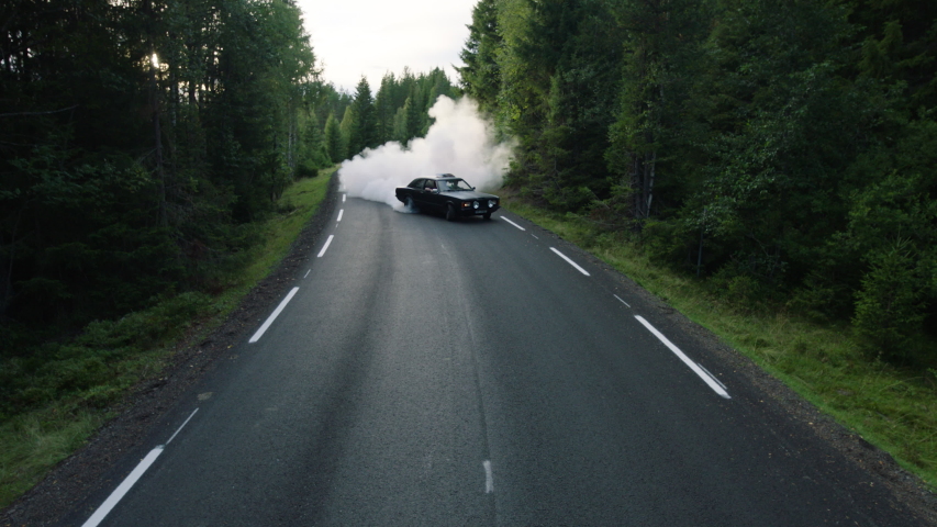 Car drifting on asphalt in the forest | Shutterstock HD Video #1052899388