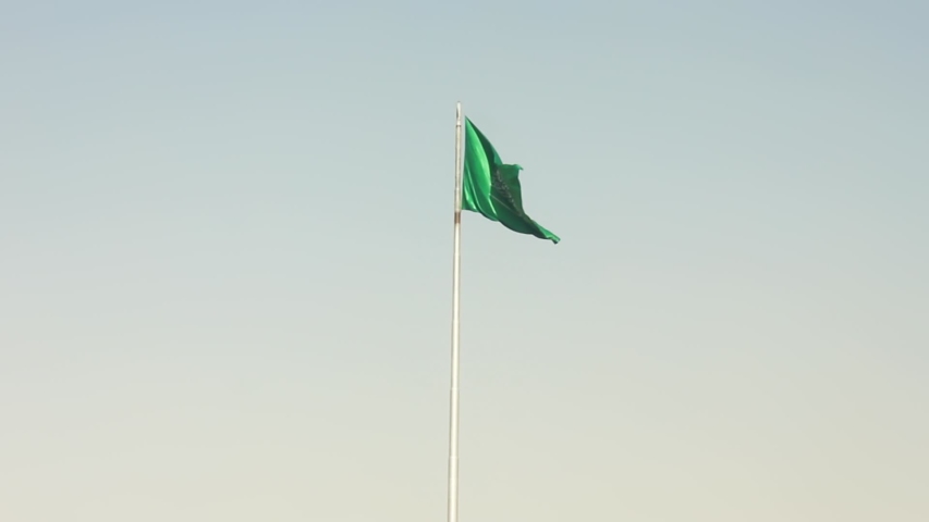 Saudi Arabia National Day showing flag in the sky with up view for the flag Royalty-Free Stock Footage #1052912192