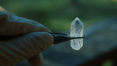 Holding a quartz crystal in hand