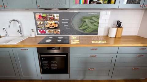 technology, future and smart home concept - modern kitchen with virtual interactive displays