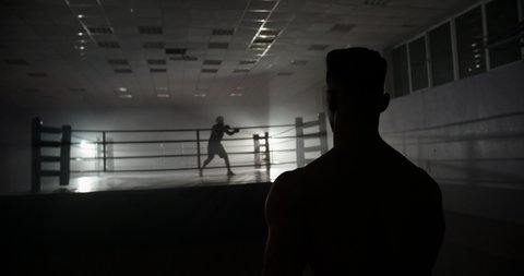 A motivated muay thai sportsman walking towards sparring ring, ready for a fight - martial arts, way to success concept 4k footage