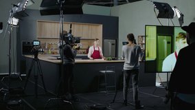 WIDE Behind the scenes of studio set, shooting TV television cooking show featuring celebrity chef, professional TV production. Shot on ARRI Alexa Mini