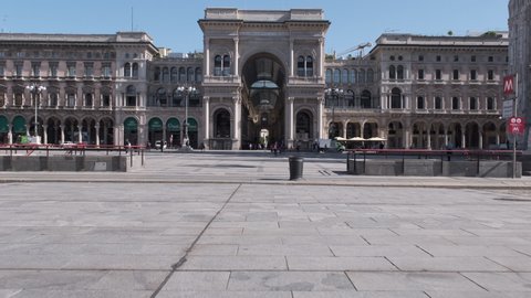 Milan/Italy - 19th May 2020: People back to the city after the Coronavirus Lockdown. Many shops still closed, almost empty city center around Duomo Cathedral and Galleria Vittorio Emanuele. 