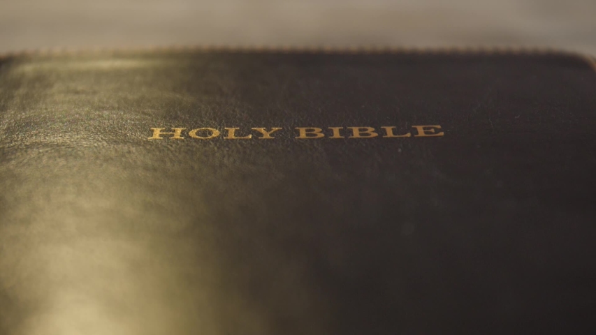Opening of Holy Bible, closeup | Shutterstock HD Video #1052931020