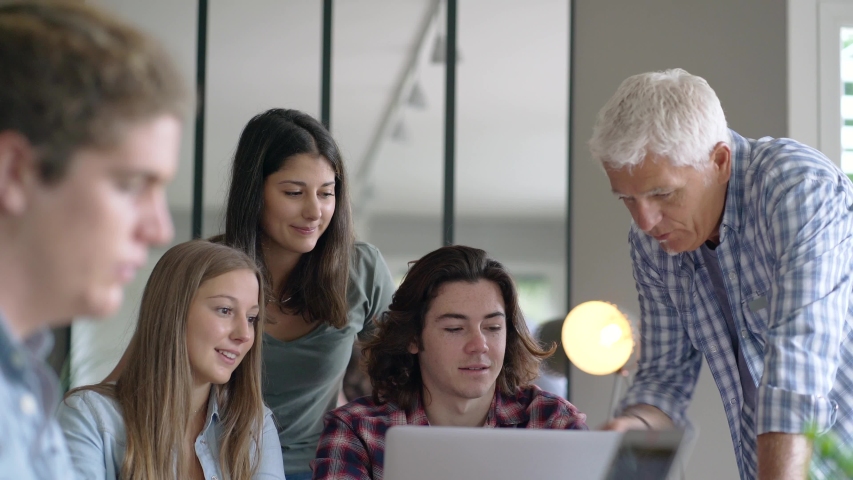 group of students working with a teacher Royalty-Free Stock Footage #1052932220