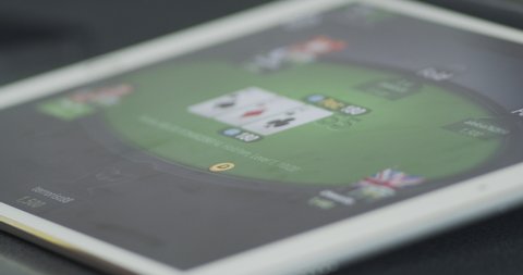 Plovdiv, Bulgaria, May 2020 - User playing online texas holdem poker on a tablet device