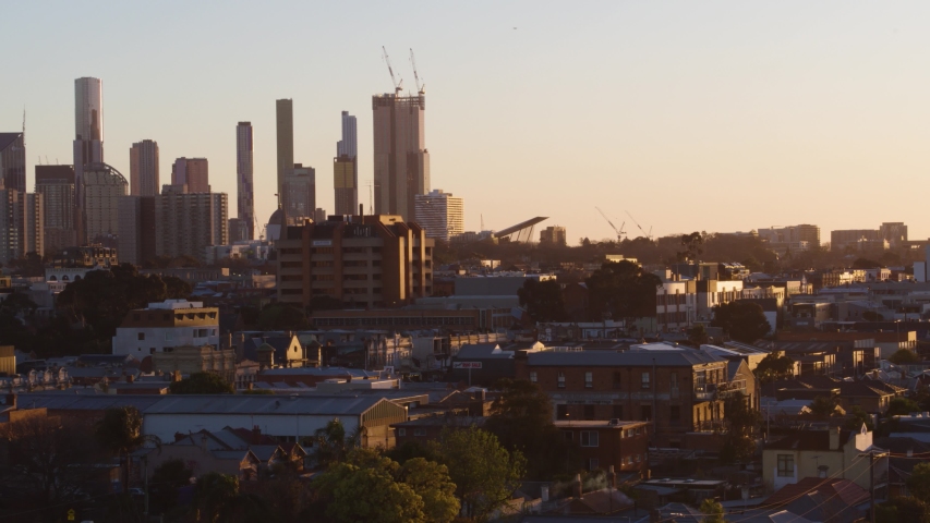 Dusk in Melbourne City, Victoria Australia Drone Cityscape View from Eastside of CBD filmed with telephoto Drone Zoom Lens Cinematic Movement and horizontal pan