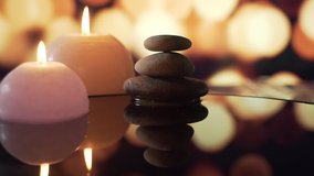 spa or health club, dropping a pure water drop from a leaf. background bokeh of blurred burning candles scented environment. Concept: relaxation, wellness, body care, spa, nature  - Powered by Shutterstock - Get 15% off with code: PIKWIZARD15