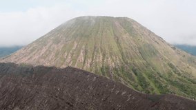 Video of rocks with volcanic rock and sand dune on background on Java island in Indonesia