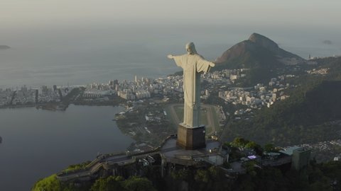 Rio de Janeiro, Brazil - January 27th, 2020: Aerial, tracking shot of Christ the Redeemer during sunrise in the summer time