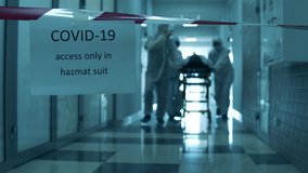 Paramedics are transporting a patient along the hall in lockdown. Covid-19 concept. - Powered by Shutterstock - Get 15% off with code: PIKWIZARD15