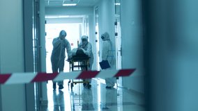Paramedics are taking a patient through a hall under lockdown. Covid-19 concept. - Powered by Shutterstock - Get 15% off with code: PIKWIZARD15