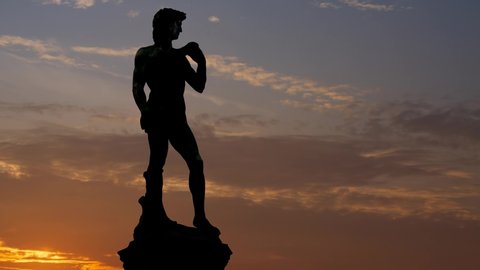 Statue of David by Michelangelo, Time Lapse at Sunrise with Silhouette of Sculpture in Florence, Italy
