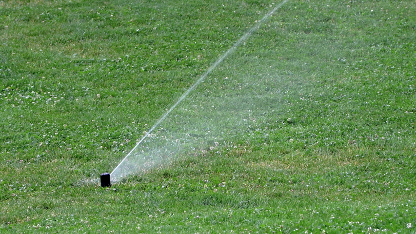 sprinkler action watering grass lawn Stock Footage Video (100% Royalty ...