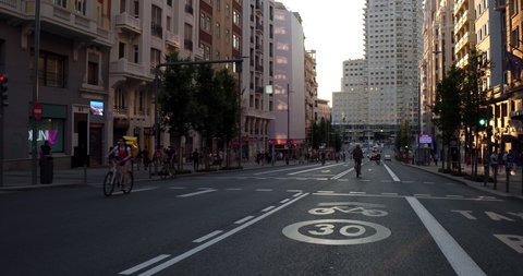 (subjective image) circulating on Madrid's Gran Vía at night between vehicles and bicycles in the state of alarm in Spain by COVID-19. Filmed on May 22, 2020.