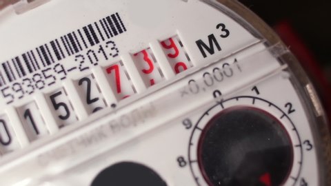 Water meter shows household consumption of water, close up.