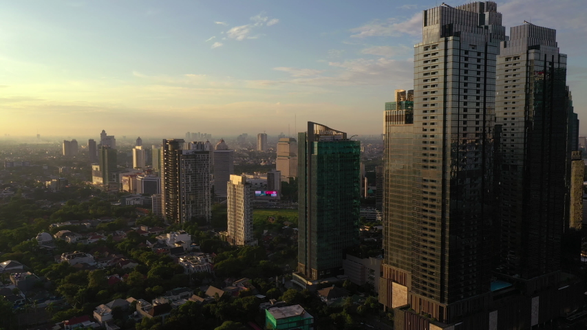 Sunset sun light jakarta city downtown luxury private residence district aerial panorama 4k indonesia | Shutterstock HD Video #1052988356