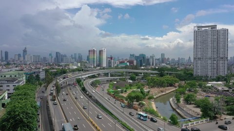 sunny day jakarta city downtown traffic street road aerial panorama 4k indonesia