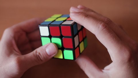 Krasnoyarsk, Russia, May 20 2020: Rubik's cube in the hands of a man close up