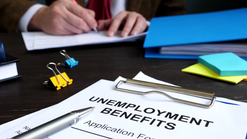 Unemployment benefits application form and manager in the office. Royalty-Free Stock Footage #1052994614