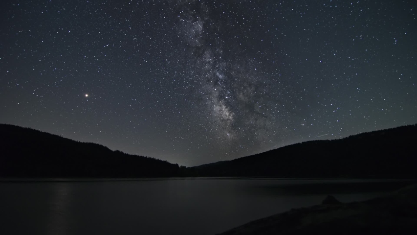 Stars, Planet Mars and the Milky Way over a Mountain Lake Night Time Lapse Royalty-Free Stock Footage #1052998487