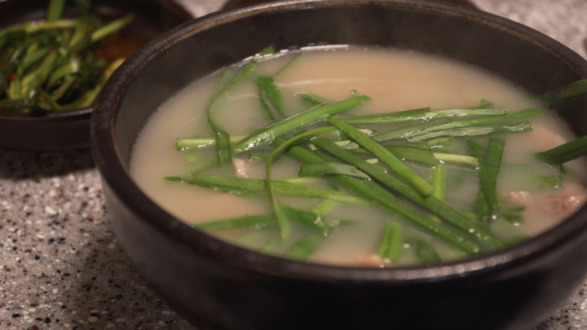 Korean traditional food, Pork and Rice Soup, Dwaeji-gukbap. It's very popular especially in Busan, South Korea. Royalty-Free Stock Footage #1053000341