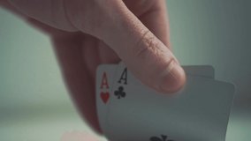 Close-up of poker cards, player checking his hand before making bet, slow motion - Powered by Shutterstock - Get 15% off with code: PIKWIZARD15
