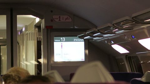 FRANCE - CIRCA 2015: Digital display with the speed of a TGV (Train Grande Vitesse) - more than 300 km/h with the view of the passenger and wagon interior