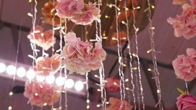 decorative roses and garlands of light bulbs luxury party decoration in pink style