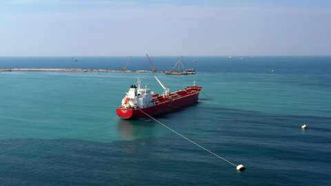 Oil spills out of a ship to Mediterranean Sea- Aerial View Drone view of oil Chemical Tanker Tied with strings Spills oil in the sea
I