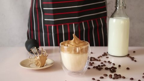 Dalgona coffee. Trending Korean drink. Whipped coffee with chilled milk.