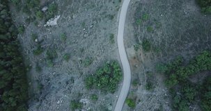 car traveling on mountain and forest road in autumn landscape. travel and journey concept drone video. 