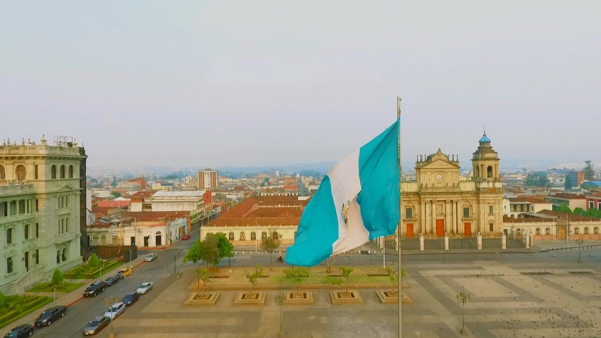 Parque central Guatemala, flag waving at sunset | Shutterstock HD Video #1053020657