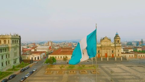 Parque central Guatemala, flag waving at sunset