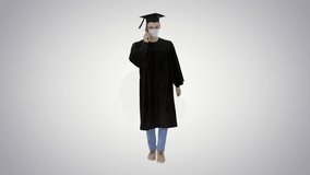 Young graduate student making a call with smartphone with medical mask on on gradient background. - Powered by Shutterstock - Get 15% off with code: PIKWIZARD15