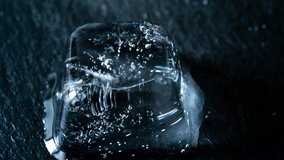 Time lapse of melting blue ice cubes on black background - Powered by Shutterstock - Get 15% off with code: PIKWIZARD15
