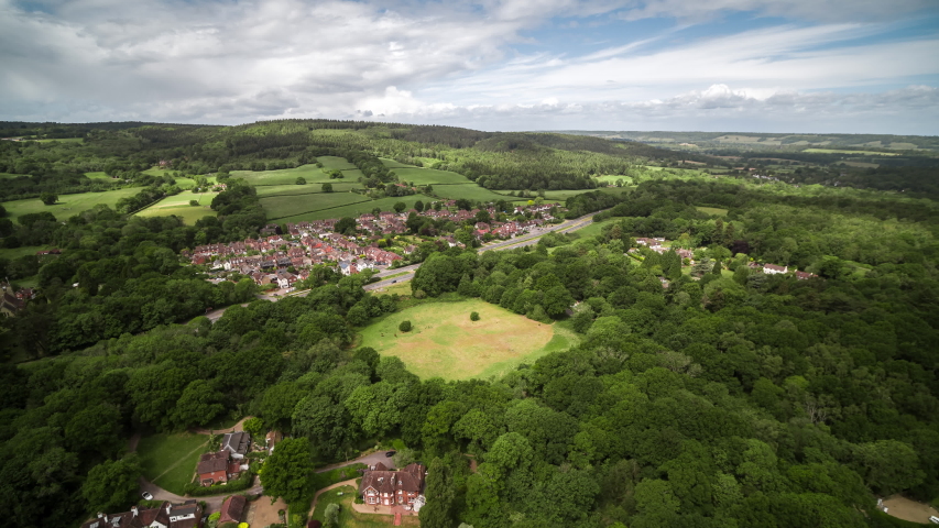 Aerial View Shot of British English Countryside, Sussex Surrey, United Kingdom Royalty-Free Stock Footage #1053035597