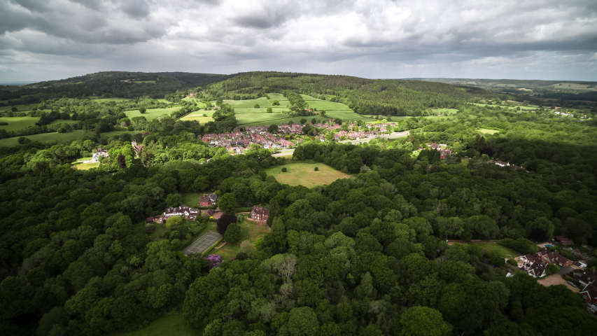 Aerial View Shot of British English Countryside, Sussex Surrey, United Kingdom Royalty-Free Stock Footage #1053035606