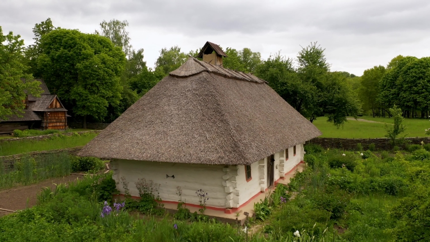 Old house of the peasants and the fence at the Museum of Pirogovo. Ukraine