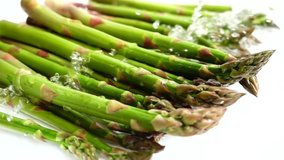 Fresh green asparagus. Water splashes. Slow motion. - Powered by Shutterstock - Get 15% off with code: PIKWIZARD15