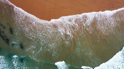 Aerial top shot from ocean waves
